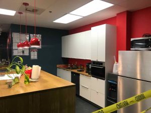 Commercial kitchen inside office suite for 50 employees. Complete remodel and upgrade, including cabinets, plumbing, custom island, painting and flooring.